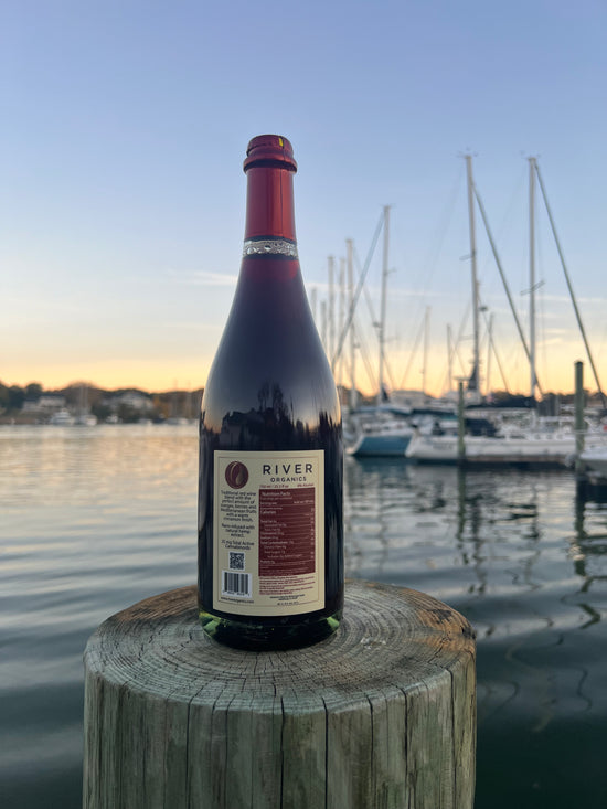 back of cbd sangria on dock near water at sunset