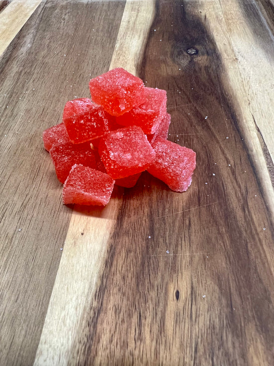 Fruity cbd gummies on wooden plank