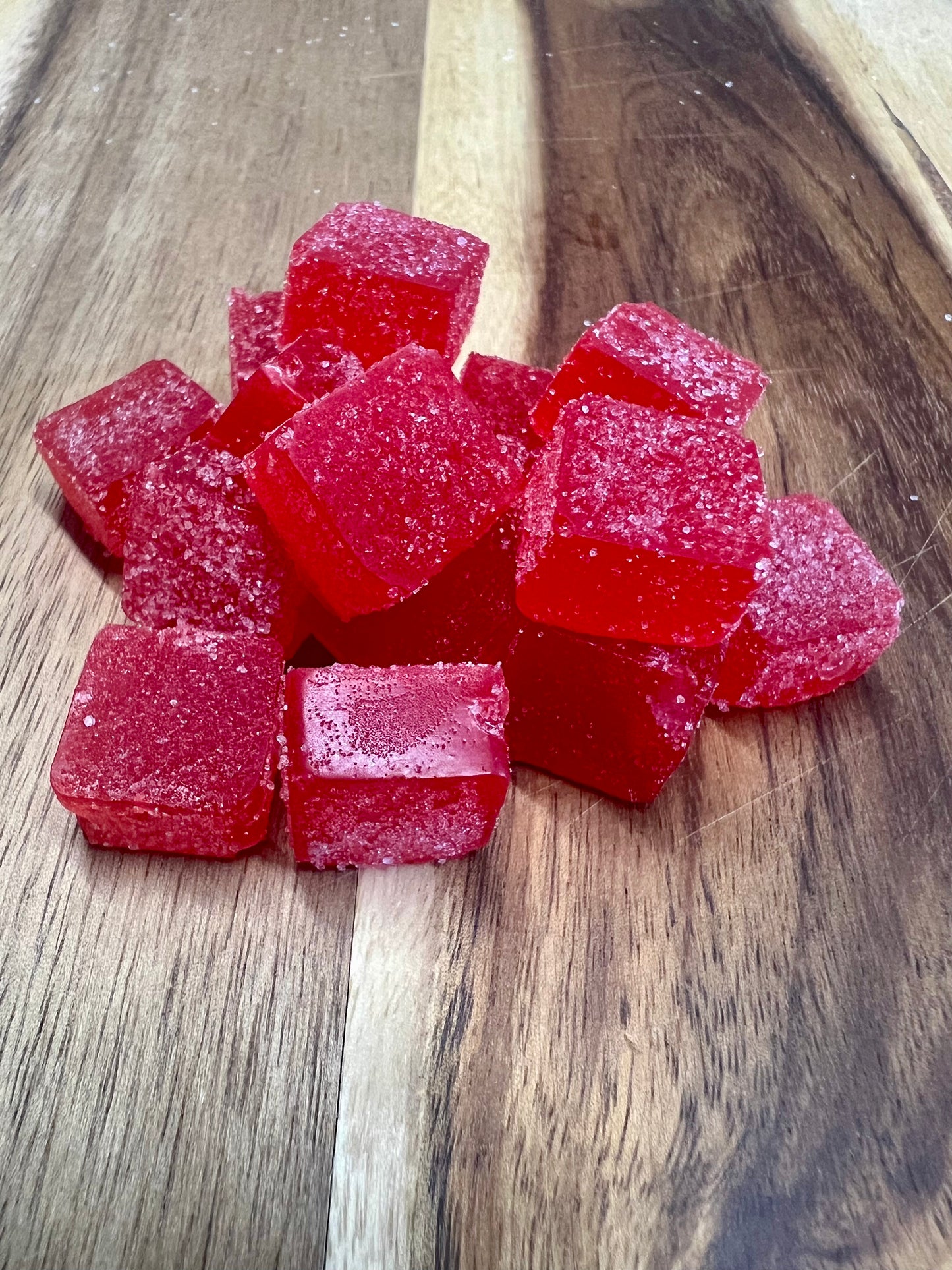 Cherry cbd gummies on wooden plank